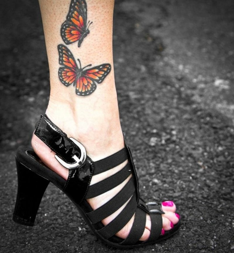 Schmetterling Tattoo Bein Monarchfalter