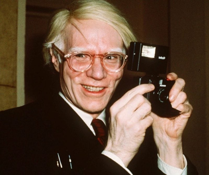 Pop artist Andy Warhol smiles in New York in this 1976 file photo.