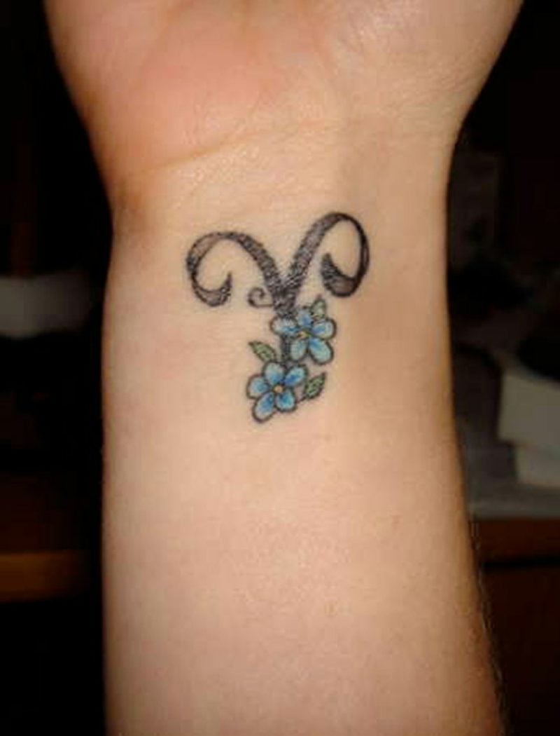 widder tattoo Blue Flowers And Aries Tattoo On Wrist