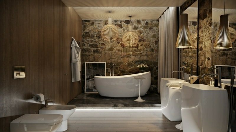 Luxus Badezimmer Akzentwand Natursteinverkleidung grosse Badewanne aus Porzellan indirekte Akzentbeleuchtung